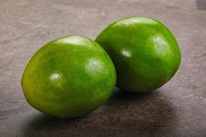 Two ripe green exotic avocado fruit photo