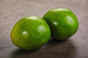 Two ripe green exotic avocado fruit photo