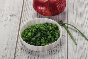 Diced green onion in the bowl photo