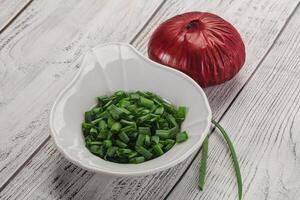 Diced green onion in the bowl photo