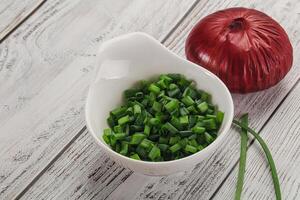 Diced green onion in the bowl photo