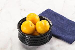 Ripe sweet and juicy Yellow Plums photo