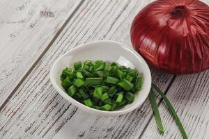 Diced green onion in the bowl photo