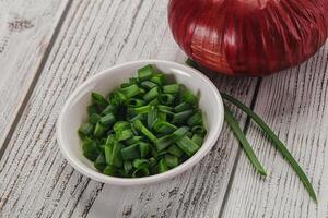 Diced green onion in the bowl photo