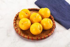 Ripe sweet and juicy Yellow Plums photo