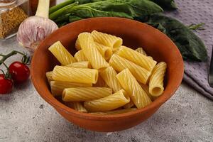 Italian cuisine - cooked pasta tortiglioni photo