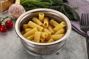 Italian cuisine - cooked pasta tortiglioni photo