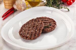 Grilled beef cutlet for burger photo