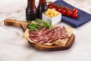 Italian pork sausage - prosciutto crudo photo