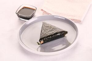 Japanese traditional onigiri with fish photo