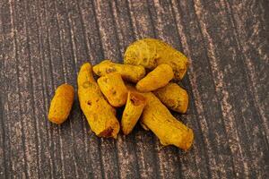 Indian spices - Turmeric root Curcuma photo