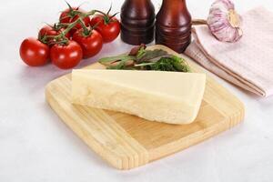 Piece Italian hard parmesan cheese photo