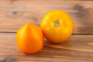 Ripe yellow bright juicy tomato photo