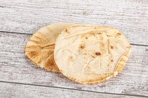 Traditional eastern round pita bread photo