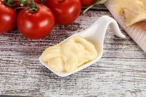 Cheese sauce in the bowl photo