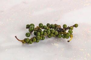 Green pepper corn heap isolated photo