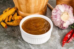 Indian curry sauce in the bowl photo