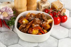 Homemade beef hungarian goulash with potato photo