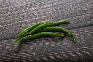 Hot and spicy green chili pepper photo