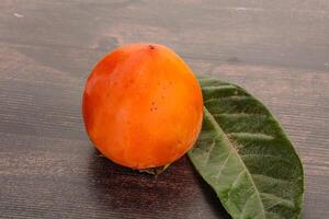 Fresh ripe sweet juicy persimmon photo