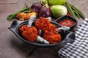 Indian cuisine glazed chicken lollipop photo