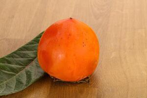 Fresh ripe sweet juicy persimmon photo