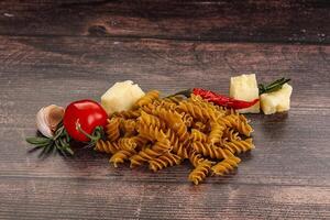 Raw whole grain pasta fusilli photo