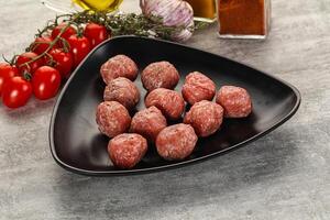 Uncooked raw beef meatball minced photo