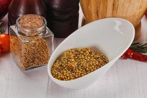 Spicy mustard sauce with seeds photo