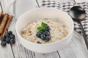 Oats porridge with blueberry photo