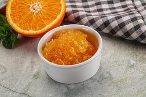 Tasty homemade Orange jam in the bowl photo