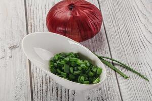 Diced green onion in the bowl photo