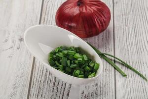 Diced green onion in the bowl photo