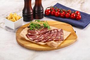 Italian pork sausage - prosciutto crudo photo