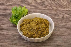 Green sauce pesto with basil photo