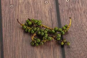 Green pepper corn heap isolated photo