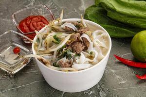 Vietnamese soup Pho Bo with beef photo