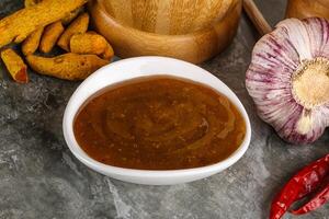 Indian curry sauce in the bowl photo