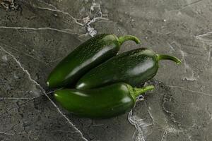 Raw green Mexican jalapeno pepper photo