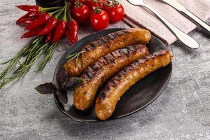 Grilled meat sausages with spices photo