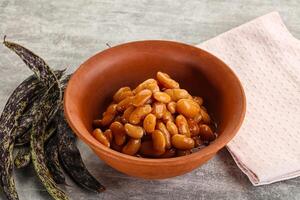 Canned white bean in tomato sauce photo