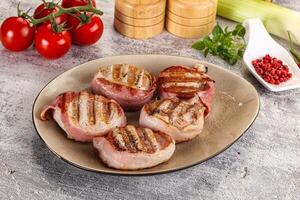 Grilled pork tenderloin with bacon photo