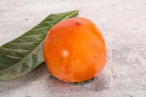 Fresh ripe sweet juicy persimmon photo