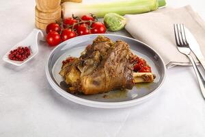 Baked Lamb shank with bone photo