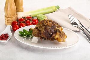 Baked Lamb shank with bone photo