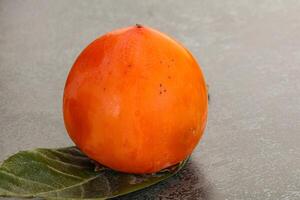 Fresh ripe sweet juicy persimmon photo