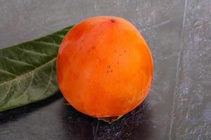 Fresh ripe sweet juicy persimmon photo