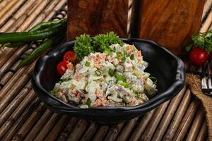 Traditional Russian salad with mayonnaise photo