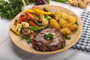 Roasted beef steak with potato photo