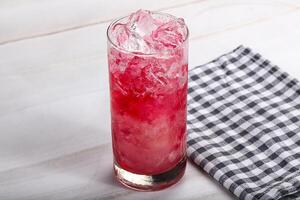 Cold strawberry cocktail with ice photo